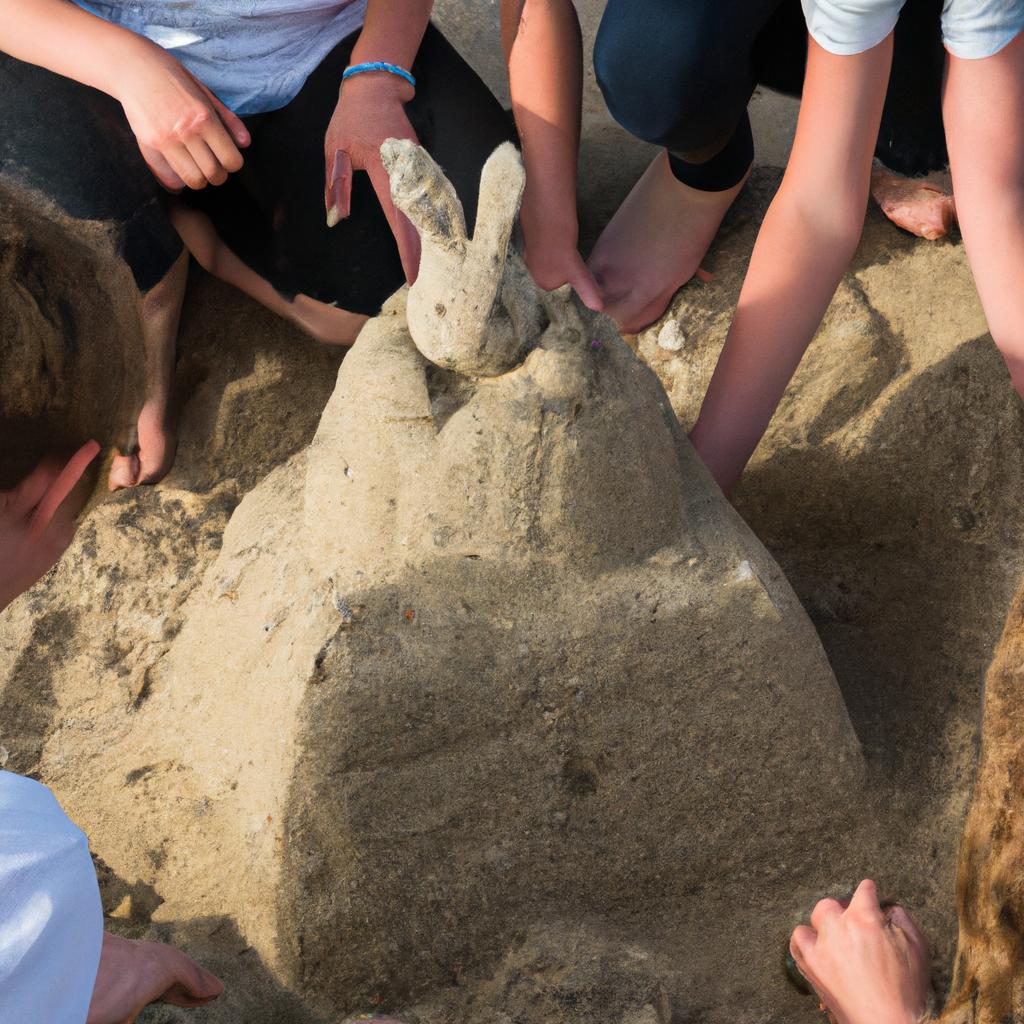 Kids having fun building a friendly sand rabbit tower of fantasy at the beach.
