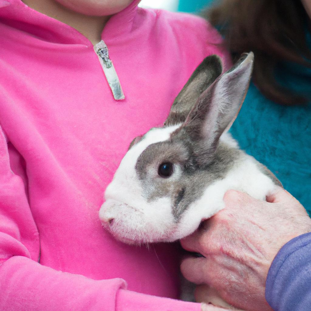 This family is excited to adopt a rescued rabbit from East Coast Rabbit Rescue and give it a loving home.